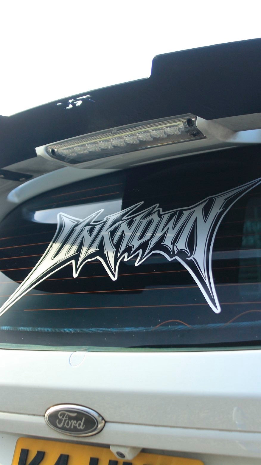 Unknown Motive Metal Banner